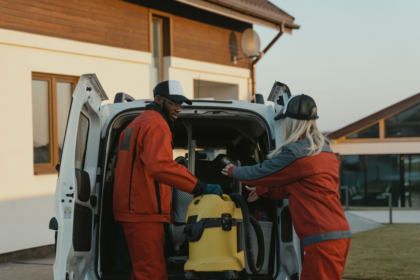 A cleaning crew by their van